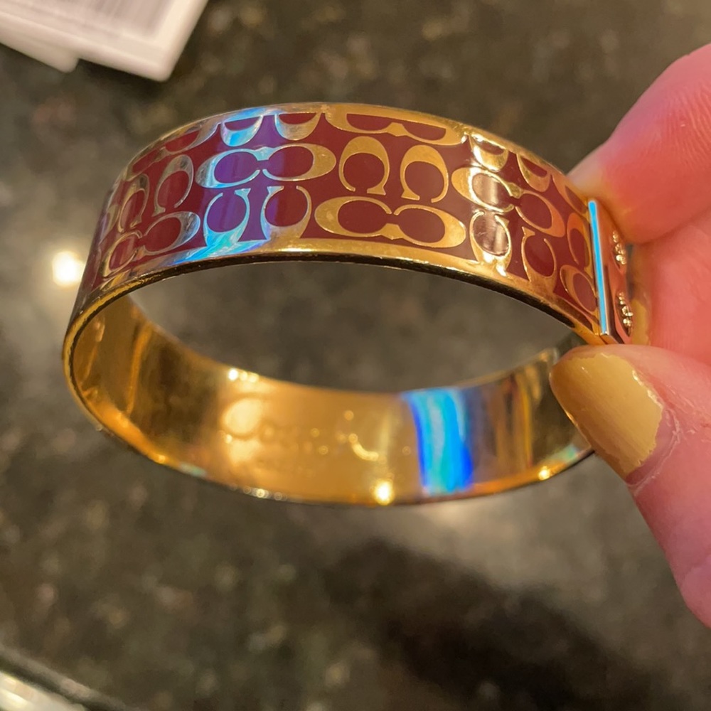COACH signature “C” gold & burgundy bangle